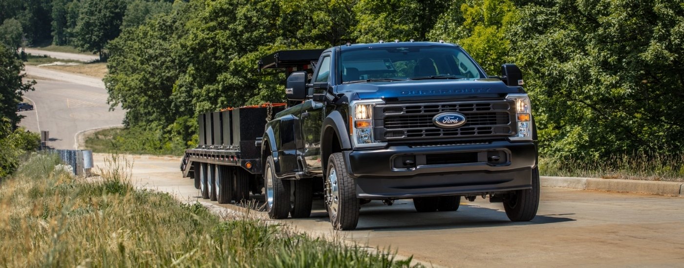 Black 2026 Ford F-450  towing a trailer